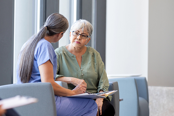 woman talking to nurse